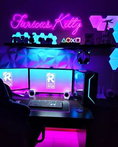 a computer desk with a keyboard and mouse on it in front of a neon sign