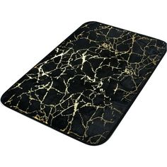 a black and gold marbled surface with white lines on the top, as well as an abstract design