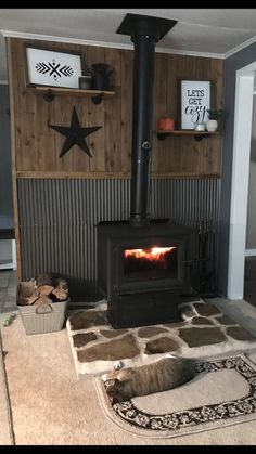 a wood burning stove sitting inside of a living room