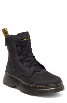 The label's Original boot gets reimagined for contemporary utility in a hybrid construction of lightweight Ajax leather and Extra Tough 50/50 fabric.The cemented Tarian lug sole is finished with DM's iconic yellow topstitching. 2" platform, 6" shaft (size 9) Lace-up style; side zip closure Textile and leather upper/leather lining/synthetic sole Imported Black Outdoor Boots With Zipper Closure, Black Boots With Zipper For Outdoor, Black Combat Boots With Zipper For Streetwear, Black Zipper Closure Boots For Outdoor, Urban Black Combat Boots For Streetwear, Black Leather Waterproof Boots With Zipper, Black Leather Waterproof Boots With Zipper Closure, Nylon High-top Boots For Outdoor Work, Urban Black Ankle Boots