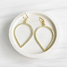 These simple marquise-shaped earrings can pair up your daytime or evening ensembles. MATERIAL: Gold/silver plated brass CLOSURE: Gold/silver plated leverback LENGTH: 2.4" long Earrings Dangle Simple, Gems Jewelry, Chandelier Earrings, Gold And Silver, Simple Style, Fashion Earrings, Statement Earrings, Silver Color, Beautiful Jewelry