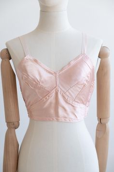 Era: 1940 Details: Late 1940's Rose satin long line brasserie with an elasticated strap and hook and eye side closures. Highly wearable as a lingerie piece or bralette. Measurements:  Best Fits Size 26DD Band: 26" Cups: 7.5"  Fabric: Rayon Condition: Excellent Vintage Condition If appropriate for the garment, I always wash or dry clean Dressed in History vintage items before offering them for sale and they will arrive with you in clean condition. Vintage items have lived a life prior to reaching 1940 Clothing, Vintage Bra, Cotton Gowns, Lingerie Inspiration, Bra Pattern, Lace Pink Dress, Photo Journal, 1940s Fashion, Vintage Lingerie