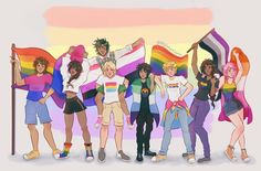 a group of young people standing next to each other holding rainbow colored flags and smiling at the camera