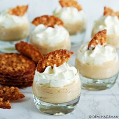 small desserts with whipped cream and crackers on the side are ready to be eaten