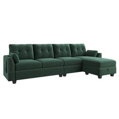 a green sectional sofa with studded arms and footstools on an isolated white background