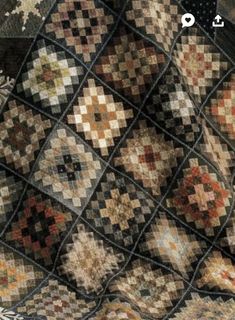 an image of a quilt made with squares and other patterns on the cover of a book