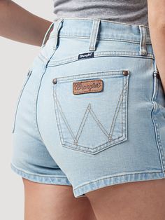 DENIM FOR WARMER DAYS From the moment you slip into our women’s Wrangler Retro® high-rise hemmed short, you won’t want to wear anything else all summer long. These denim shorts are thoughtfully made from a partially recycled cotton blend with just a hint of stretch for comfort. They come with a 10 1/4“ rise to accentuate your shape and a 3 1/2“ length for showing off your legs. Plus, these high-rise shorts come with our signature five-pocket styling, ‘W’ embroidery, and a Wrangler® rope logo pat Amazon Clothes, Wrangler Jeans, High Rise Shorts, Best Jeans, Western Wear, Recycled Cotton, Patch Logo, Retro Fashion, Denim Shorts