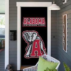 the front door of a house with an elephant on it's side and letters that read, alabama