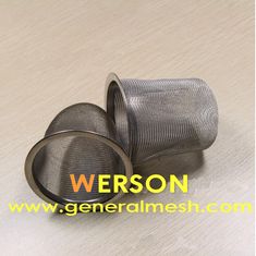 two stainless steel mesh strainers sitting on top of a wooden table next to each other