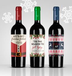 three bottles of wine are shown in front of snowflakes