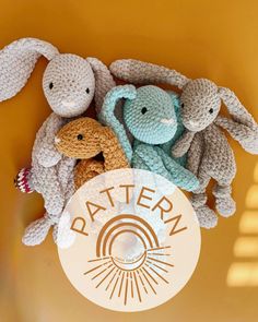 three crocheted stuffed animals sitting next to each other on a yellow background with the word pattern written below them