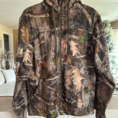 Great Outdoor Zip Up Jacket, Never Worn New W/O Tags Fall Hunting Outerwear With Fleece Lining, Fall Camouflage Outerwear With Fleece Lining, Camouflage Long Sleeve Outerwear For Cold Weather, Windproof Hooded Hunting Outerwear, Windproof Hooded Outerwear For Hunting, Hooded Windproof Outerwear For Hunting, Winter Hunting Long Sleeve Sport Coat, Casual Windproof Hunting Outerwear, Winter Hunting Sport Coat With Long Sleeves