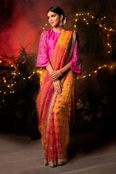 Pink, orange saree with floral printed motifs and embroidered detail. Paired with floral hand embroidered blouse.
Component: 2
Printed
Neckline: Round
Sleeve Length: Three quarter
Fabric: Handwoven Sheer Silk
Color: Pink,Orange
Embroidered blouse - Aza Fashions Orange Organza Saree, Leheriya Saree, Saree Painting Designs, Orange Saree, Saree For Women, Hand Painted Sarees, Blouse For Women, Organza Saree, Silk Sarees Online