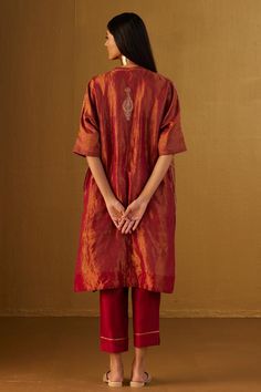 Red kaftan in Mughal brocade with floral patterns and minimal zardozi embroidery. Comes with red cotton silk pant.
Components: 2
Type Of Work: Floral
Neckline: V Neck
Sleeve Type: Three Quarter
Fabric: Kurta: Brocade and Handloom tissue, Pant: Cotton Silk, Lining: Shantoon
Color: Red
Other Details: 
Lace trims
2 pockets on kaftan and pant
Partially elasticated waistband
Length:
Kaftan: 41 inches
Pant: 36 inches
Model height: 5ft 9inches, wearing size M
Note: Dupatta worn by the model is not for Traditional Drape Chanderi Kurta For Rituals, Chanderi Traditional Drape Kurta For Rituals, Traditional Chanderi Kurta For Rituals, Traditional Drape Silk Palazzo Set With Self Design, Silk Palazzo Set With Traditional Drape Self Design, Red Brocade Kurta With Traditional Drape, Unstitched Silk Traditional Wear For Rituals, Traditional Red Brocade Kurta, Silk Traditional Wear For Festive Rituals