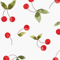 cherries with green leaves and red berries are flying in the air on a white background