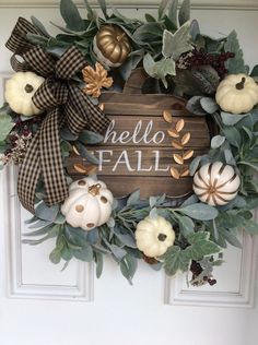 a wreath with the words hello fall written on it