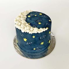 a blue and white cake with stars on it