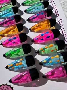 This listing is for a full set of 20 hand painted Y2K jelly lava lamp press on nails. These are reusable gel nails shown in a long stiletto shape. Any length and shape can be chosen in the variation section.  *Please note that due to the nature of re-creating designs made-to-order in the shape and sizing requested at the time of order, designs made differ slightly based on the shape and length chosen. These are custom designed works of art and any variations in the design shown in the listing are part of the unique appeal of hand-painted designs. Colors may look different in person and depend on the screen resolution as well. All listing photos have been taken in natural lighting and are unaltered. I would be happy to send pictures of your order before sending them off if you would like to