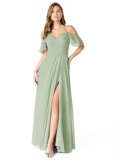 a woman in a long green dress with one leg slited and the other side split open