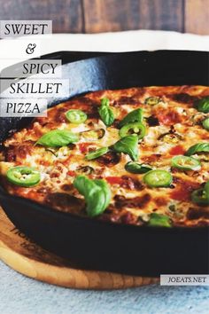 a pizza sitting on top of a wooden cutting board