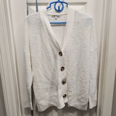 In Excellent Condition White Button-up Sweater For Fall, White Button-up Sweater For Layering, Classic White Soft Knit Outerwear, White Button-up Cardigan For Layering, Cozy White Button-up Cardigan, White Knit Button-up Cardigan, White Knit Button-up Sweater, White Cardigan With Button Closure For Layering, White Button-up Knit Cardigan