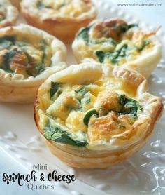 mini spinach and cheese quiches on a white plate with text overlay that reads mini spinach and cheese quiches