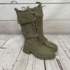 Step Out In Style With These Military Green Waxed Finish Laced Boots From Zara. The Round Toe And Knee-High Shaft Style Make Them Perfect For Casual Occasions, While The Zip Closure And Block Heel Style Add A Touch Of Sophistication. These Boots Are Made With High-Quality Polyurethane Material That Ensures Durability And Comfort. The Boots Come In A Standard Shoe Width, With A Regular Calf Width, And Mid-Height Heel. They Are Suitable For Wearing In Fall, Winter, And Spring Seasons. The Solid Pattern And Army, Biker, And Motorcycle Themes Make These Boots A Must-Have For Any Fashionista. Get Your Hands On These Zara Boots Today And Elevate Your Style Game! Please See All Photos, Has Faint M Laced Boots, Zara Boots, Boots Womens, Green Olive, Zara Shoes, Solid Pattern, Military Green, Lace Boots, Shoes Heels Boots