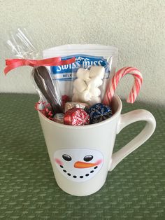 a coffee cup filled with candy and candies