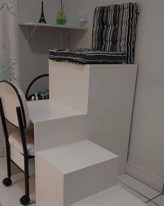 a chair and some stairs in a room