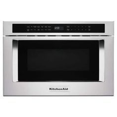 a stainless steel microwave oven with the door open