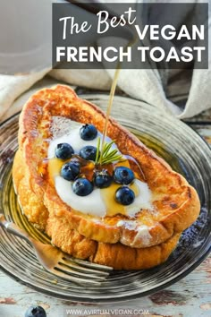 french toast with blueberries and yogurt being drizzled on top