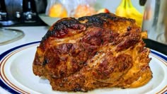 a piece of meat sitting on top of a white plate