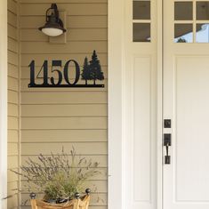 a house number sign on the front door