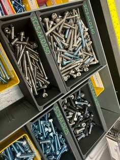 there are many bolts and screws in the box on the shelf next to each other