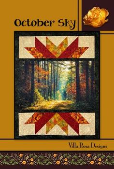 the cover of october sky quilt book, featuring an image of a forest with trees and leaves