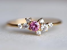 Pink Sapphire Engagement ring, sapphire engagement ring, Cluster engagement ring, Cluster ring, Sapphire and Diamond ring, Birthstone ringSame design can be made also with other custom gemstones per request. Product details:- Solid gold- Diamond - 1.5mm, 2mm, 2.5mm, pink sapphire - 3mm- 1.1mm band- Diamond clarity - VS, Color - E-F- Made to order - 8 to 10 business days.Ring size - US 3 to US 9 (for smaller or larger ring size, please contact)Please select your size at the drop down menu. Servic Wedding Rings With Brilliant Cut Pink Sapphire, Fine Jewelry Pink Sapphire Birthstone Ring For Wedding, Pink Sapphire Birthstone Ring For Weddings, Wedding Rings In Diamond White Pink Sapphire, Anniversary Rings With Rose Cut Pink Sapphire, Pink Sapphire Birthstone Ring With Accent Stones For Wedding, Wedding Pink Sapphire Birthstone Ring With Accent Stones, Wedding Pink Sapphire Ring With Center Stone, Cluster Sapphire Ring With Prong Setting For Promise