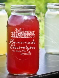 two jars filled with homemade electrolytes sitting on a table next to each other