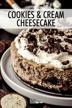 cookies and cream cheesecake on a plate with oreo crackers in the background