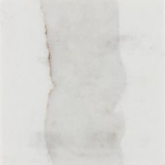 a piece of white marble with brown streaks