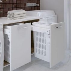 a washer and dryer sitting next to each other in a room