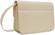 Buffed leather shoulder bag in beige. · Adjustable shoulder strap · Accordion panel at sides · Logo stamp at back face · Patch pocket at back face · Magnetic tab-slot flap · Patch pocket at two compartment interior · Suede interior · Cotton canvas lining · Logo-engraved gold-tone hardware · H7.25 x W9.75 x D3 Supplier color: Cream Cream Rectangular Shoulder Bag With Magnetic Closure, Versatile Cream Shoulder Bag, Beige Flap Bag With Adjustable Strap For Business, Beige Business Flap Bag With Adjustable Strap, Classic Beige Shoulder Bag With Magnetic Closure, Beige Flap Bag With Detachable Strap, Beige Rectangular Saddle Bag For Office, Rectangular Beige Saddle Bag For Office, Beige Flap Shoulder Bag For Office