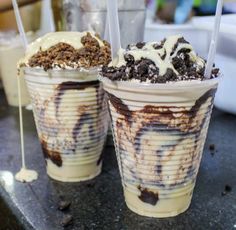 two ice cream sundaes on a table