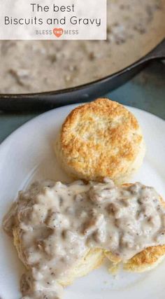 biscuits and gravy on a plate next to a skillet