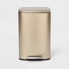 a gold trash can on a white background