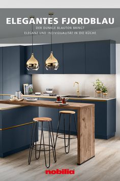 a kitchen with blue cabinets and stools