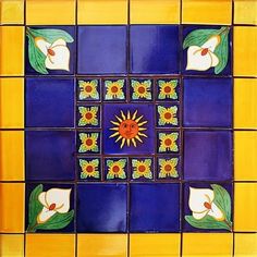 an artistic tile design with sunflowers and leaves on blue, yellow and orange tiles