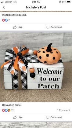 a fake pumpkin sitting on top of a wooden box with the words welcome to our patch