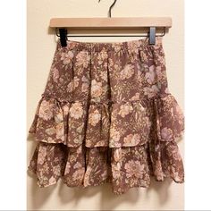 Light Brown, Ruffled Skirt With Pastel Floral Print. Elasticated, Very Stretchy Waist Two Ruffled Layers Fully Lined Never Worn, New With Tags Size Xxs Length: 17 In. Waist: Approx 13 In. Tiered Ruffled Mini Skirt In Pink, Tiered Pink Mini Skirt With Ruffles, Spring Flowy Mini Skirt With Ruffles, Flowy Ruffled Mini Skirt For Spring, Spring Flowy Ruffled Mini Skirt, Fitted Tiered Mini Skirt In Pink, Pink Fitted Tiered Mini Skirt, Ruffled Skirt For Brunch, Flowy Ruffled Skirt For Brunch