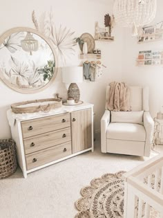 a baby's room with a crib, dresser and mirror on the wall