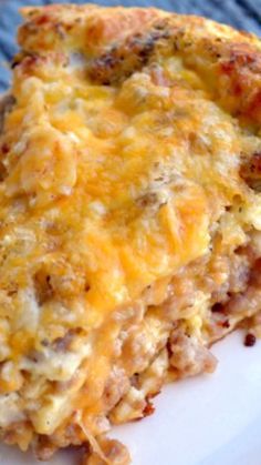 a slice of cheesy hash browns casserole on a white plate